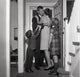Kids Welcoming Father Home Poster Print depicting a heartwarming family scene.