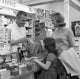 Mother and daughter shopping at chemists poster print.