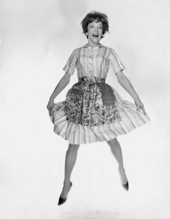 Portrait of a young woman laughing and jumping poster print