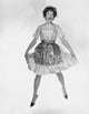 Portrait of a young woman laughing and jumping poster print