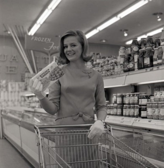 Young woman shopping in supermarket poster print