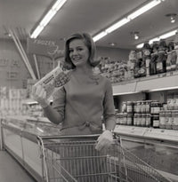 Young woman shopping in supermarket poster print