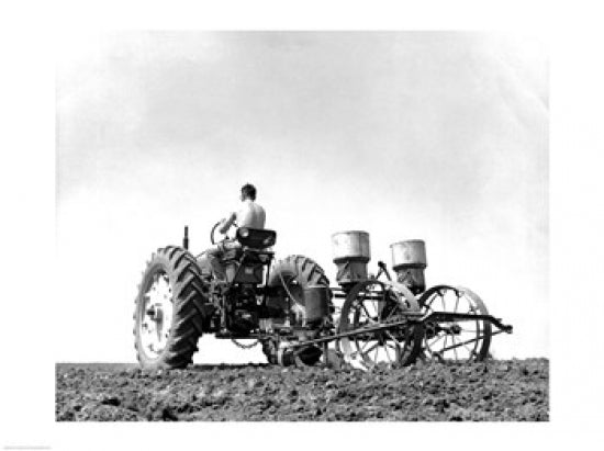 Farmer planting corn with tractor in a field poster print.
