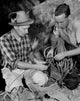 Two rock climbers preparing ropes for climbing adventure poster print.