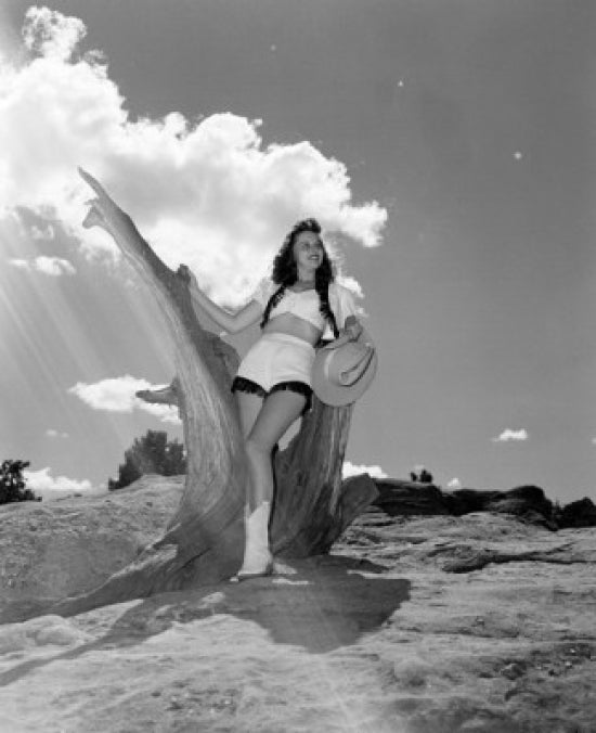 Portrait of Cowgirl in Desert Landscape Poster Print