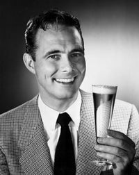 Portrait of a mid adult man holding a glass of beer poster print