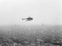 Helicopter Over New York City Poster Print showcasing the skyline.