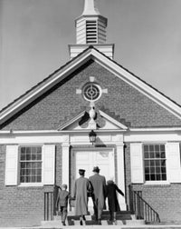 Parents with Children in Front of Church Poster Print