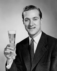 Portrait of a mid adult man holding a glass of beer poster print