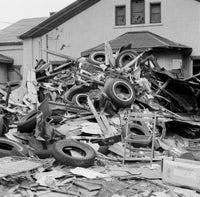Heap of Trash in Front of Abandoned House Poster Print