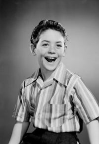 Portrait of Smiling Boy Poster Print showcasing a joyful child.