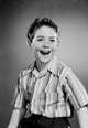 Portrait of Smiling Boy Poster Print showcasing a joyful child.