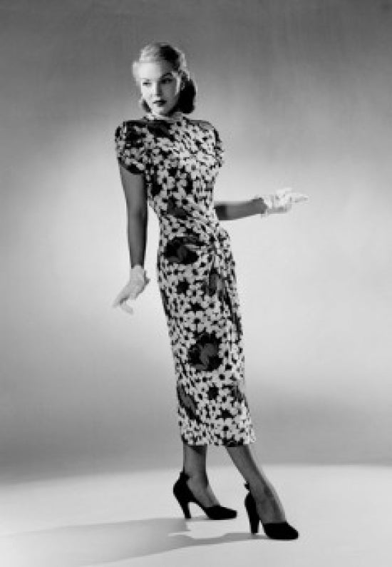 Young woman wearing dress, high heels, and formal gloves poster print.