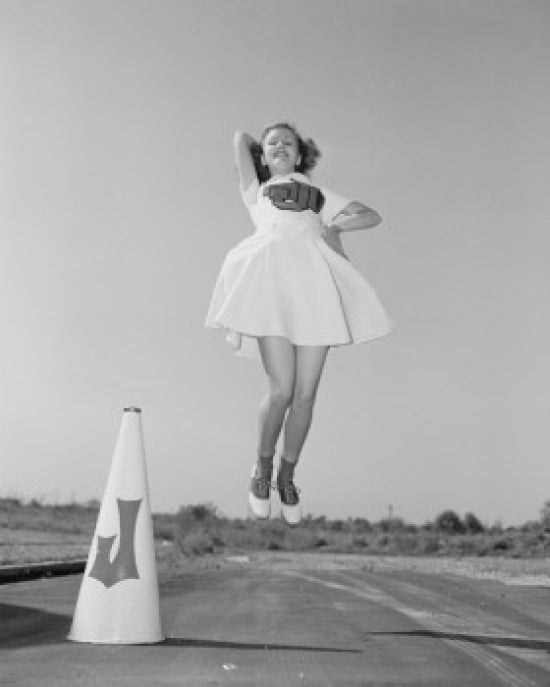 Cheerleader with megaphone jumping poster print showcasing vibrant colors and dynamic motion.