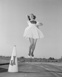 Cheerleader with megaphone jumping poster print showcasing vibrant colors and dynamic motion.