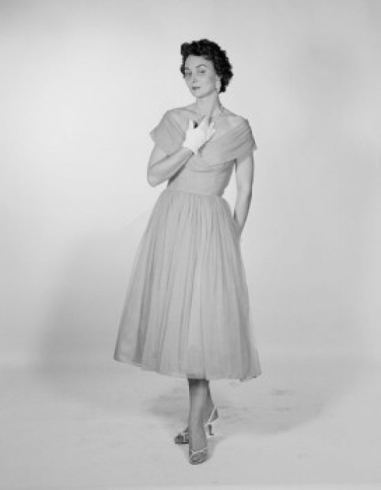Studio portrait of a mid adult woman poster print showcasing elegance.
