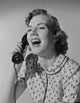 Studio portrait of young woman talking on phone poster print