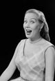 Studio portrait of a young woman laughing poster print