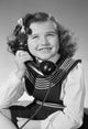 Studio Portrait of Girl on Telephone Poster Print showcasing a girl in a nostalgic moment with a phone.