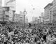 Mardi Gras crowd on Canal Street poster print showcasing festive celebration in New Orleans.