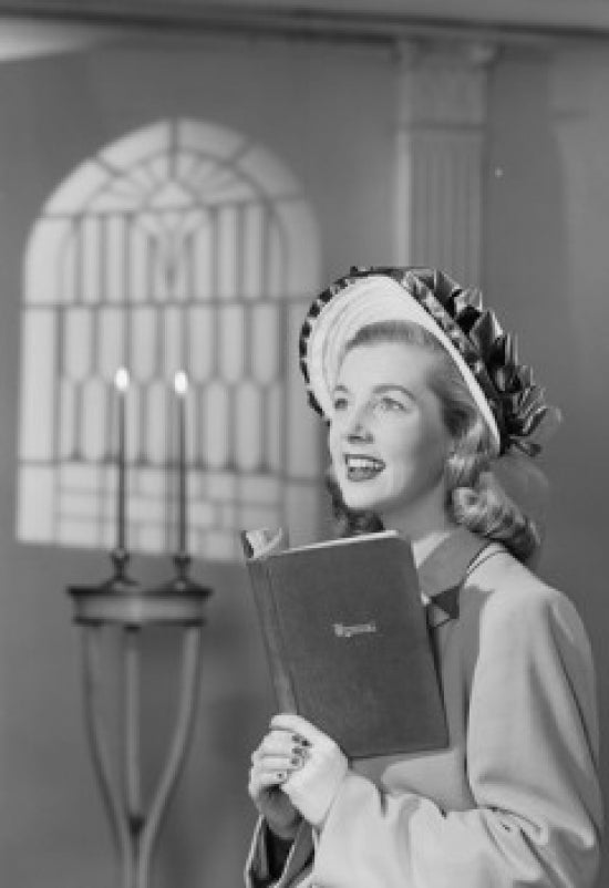 Female choir singer holding a book in church poster print