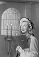 Female choir singer holding a book in church poster print