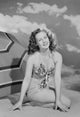 Portrait of a young woman on the beach, serene and tranquil poster print.
