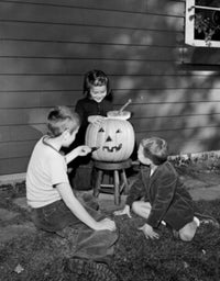 Boys and girls preparing a pumpkin for Halloween party poster print.