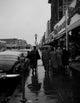 Rainy Day on Main Street Poster Print showcasing New York City scenery.