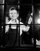 Boy Looking Through Window Poster Print depicting a child gazing out the window, colorful and imaginative artwork.