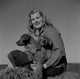 Young woman with cocker spaniels poster print, heartwarming pet art.