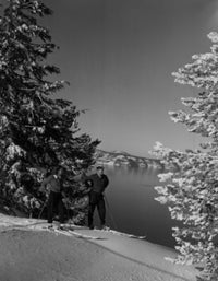 Couple cross-country skiing at Crater Lake in Oregon poster print.