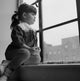 Little Girl Looking Out Window Poster Print