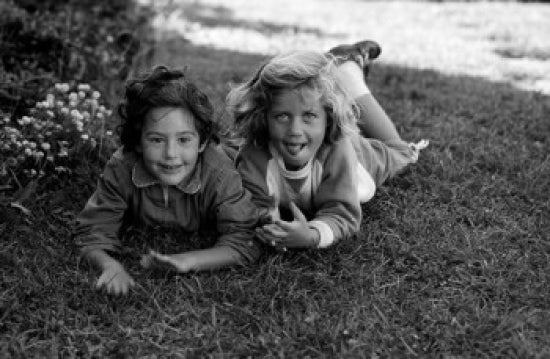 Portrait of Two Girls Relaxing on Lawn Poster Print