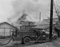 Fire Engine Next to Home Poster Print showcasing bravery and community service.