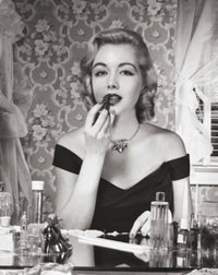 Portrait of a Young Woman Applying Lipstick Poster Print
