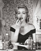 Portrait of a Young Woman Applying Lipstick Poster Print