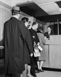 Group of People Standing in Line at a Bank Counter Poster Print