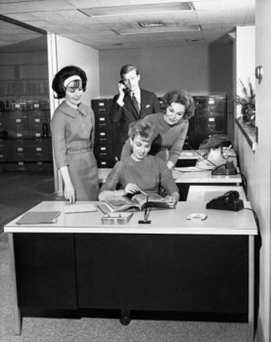 Three businesswomen and a businessman in an office poster print