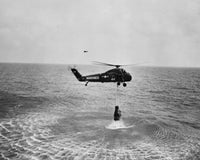 Marine helicopter lifting astronaut spacecraft out of the ocean poster print.