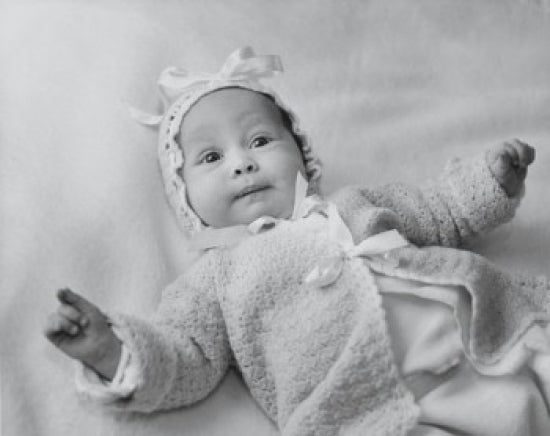 High angle view of a baby girl lying on a blanket poster print