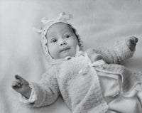 High angle view of a baby girl lying on a blanket poster print