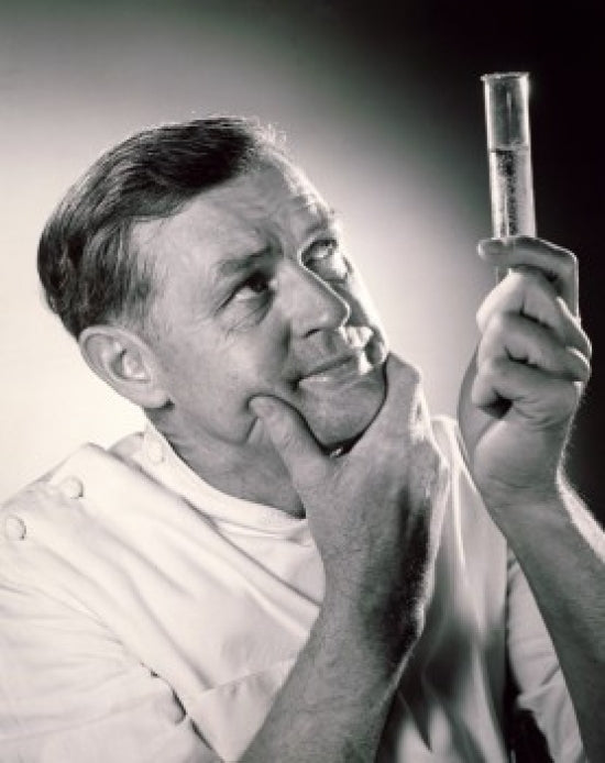 Close-up of a scientist analyzing chemicals in a test tube poster print.