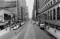 Buildings along a road in Chicago, Illinois poster print