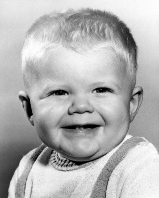 Smiling baby boy studio portrait poster print