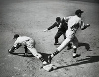 Poster featuring two baseball players and umpire on the field.