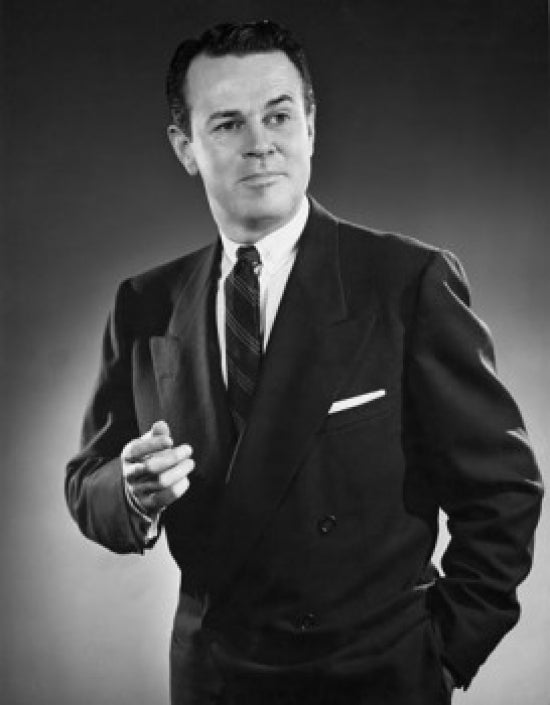 Close-up of businessman standing with hand in pocket poster print.