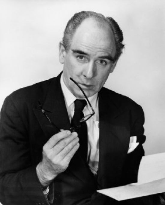 Portrait of a businessman holding eyeglasses poster print.