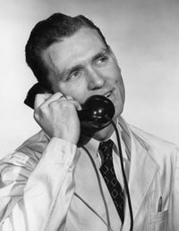 Close-up of businessman talking on telephone poster print