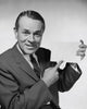 Close-up of businessman pointing to blank placard poster print.